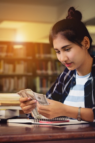 Student reviewing education loan or scholarship funds – DKP Edu Services